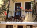 Relax on balcony overlooking olive trees